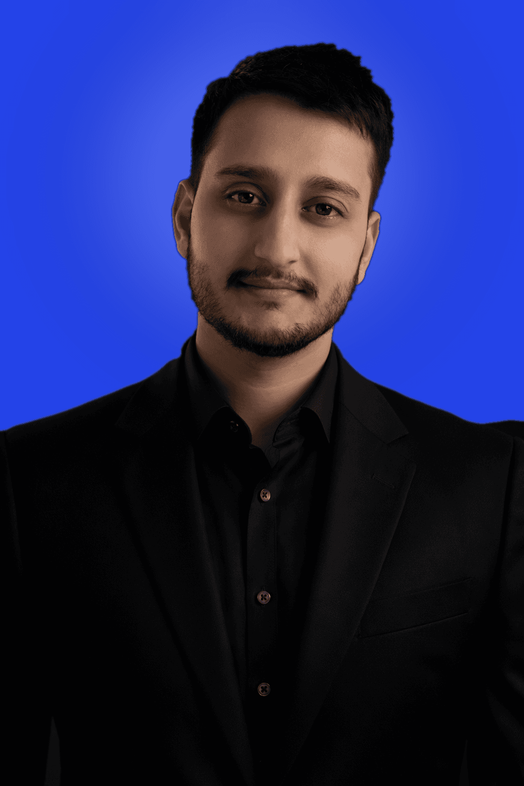 Abdul Rahman, founder of TechEdge, in a blazer against a cobalt background